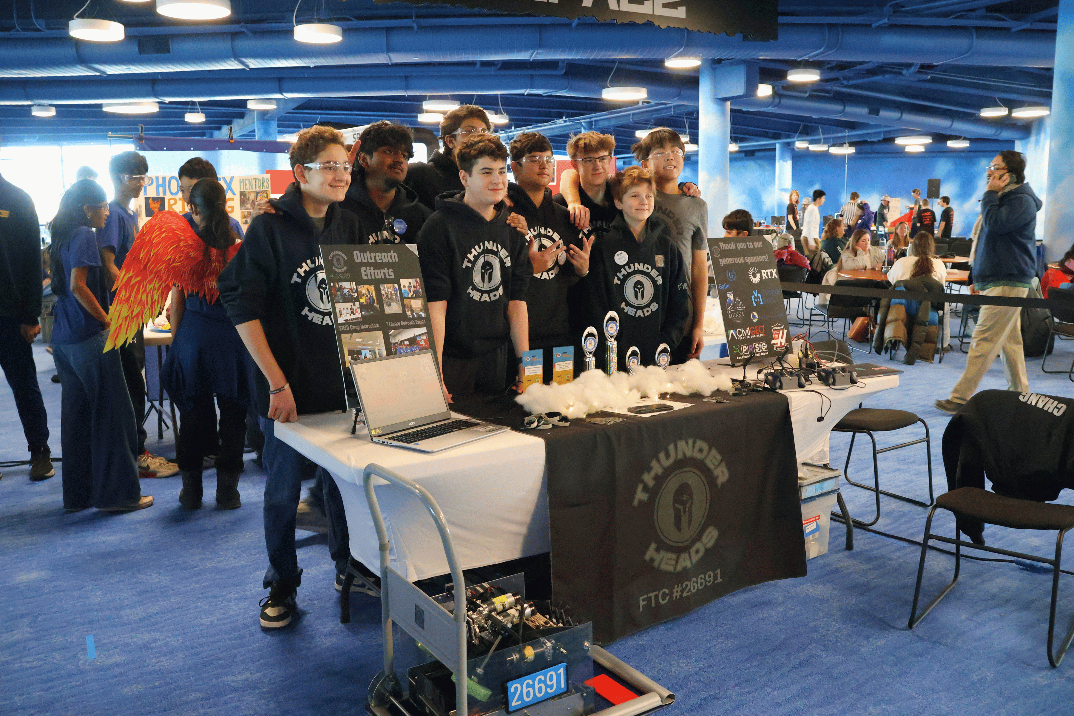 FIRST Tech Challenge team, THUNDERHeads, post for a team photo.